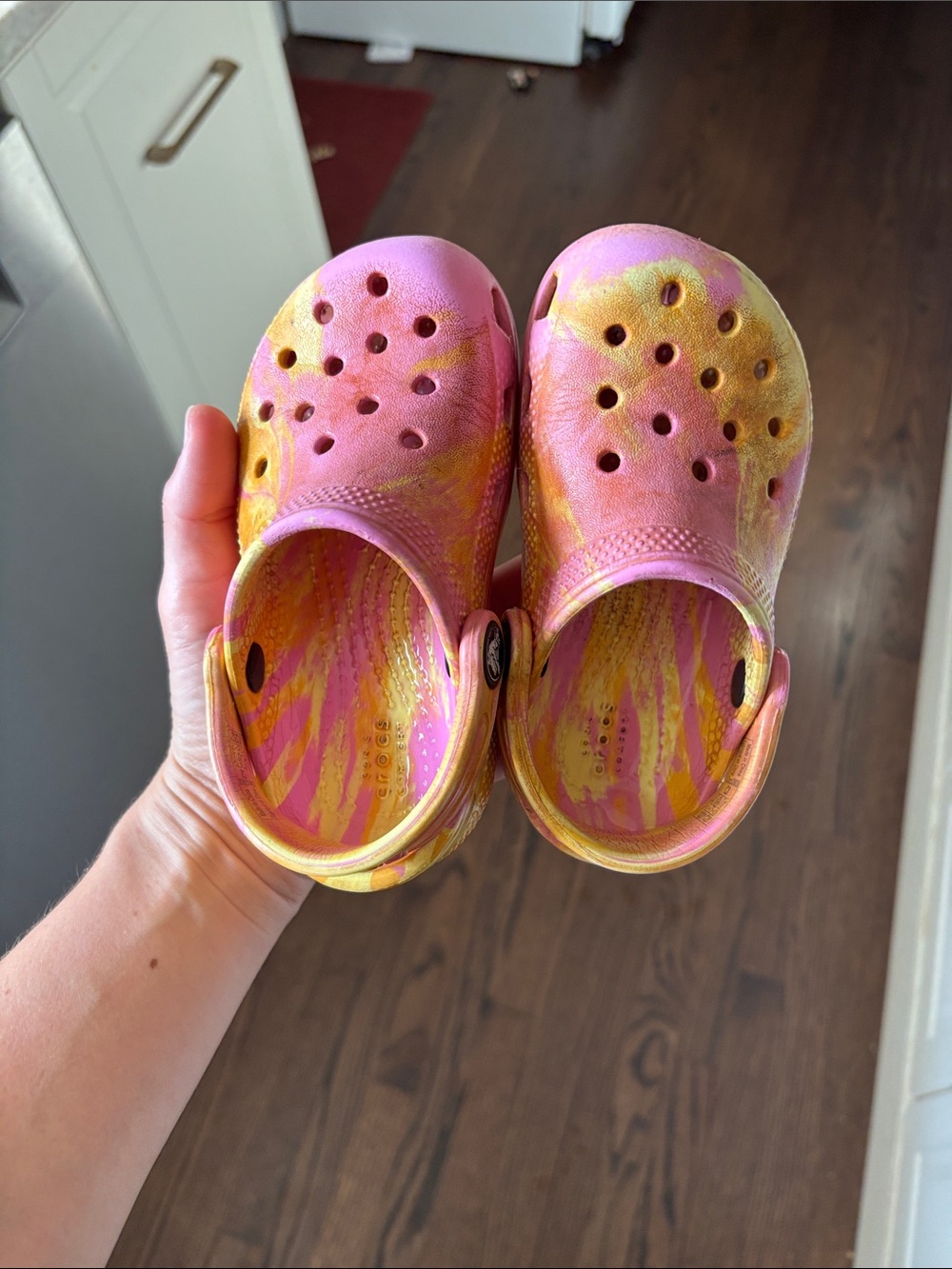 crocs pink and yellow tie dye